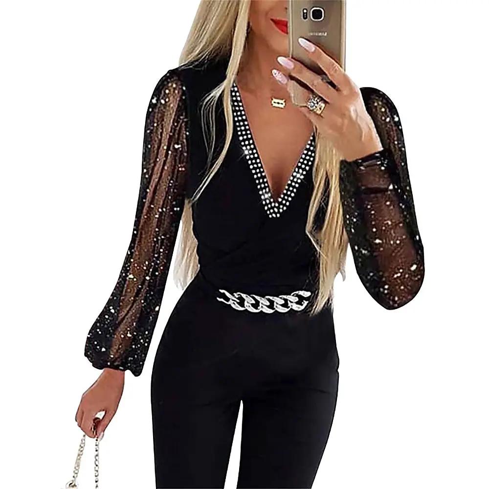 Womens black jumpsuit with V-neck rhinestone trim, sheer sequin long sleeves, and a chunky silver chain belt.