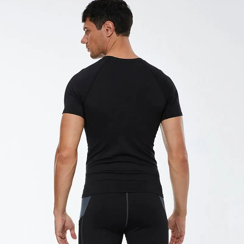 Compression T shirt for men, black quick-dry athletic top, ideal for summer workouts, running and training, back view.