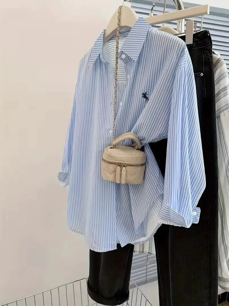 Women's striped blue-and-white button-up blouse with knight print and long sleeves