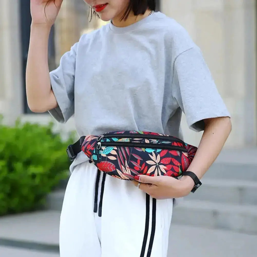Sports waist pack by Simples Market in colorful floral print with phone pocket; waterproof running belt