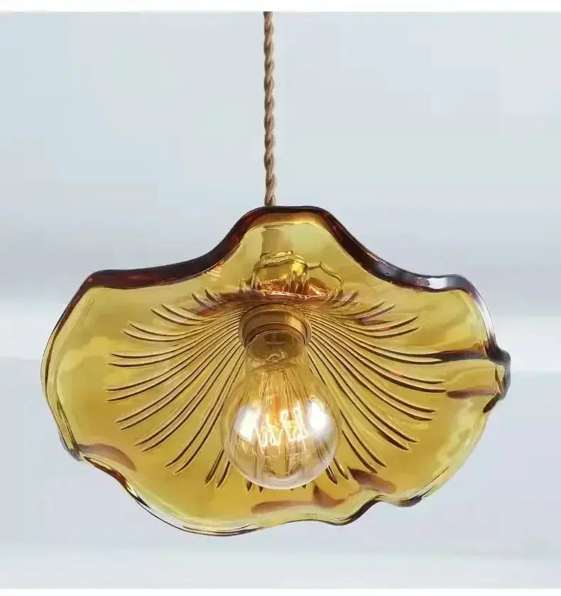 Nordic Minimalism LED Pendant Light by Simples Market with amber glass shade and copper hanging cord.