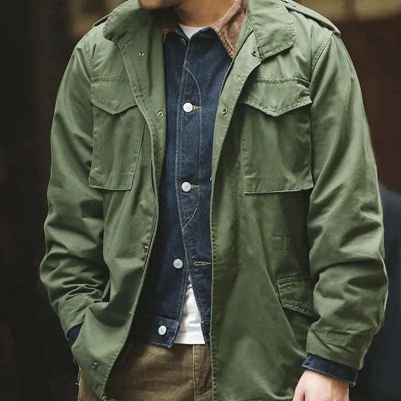 Maden Military M65 Field Jacket in green with front pockets, shown over a denim shirt