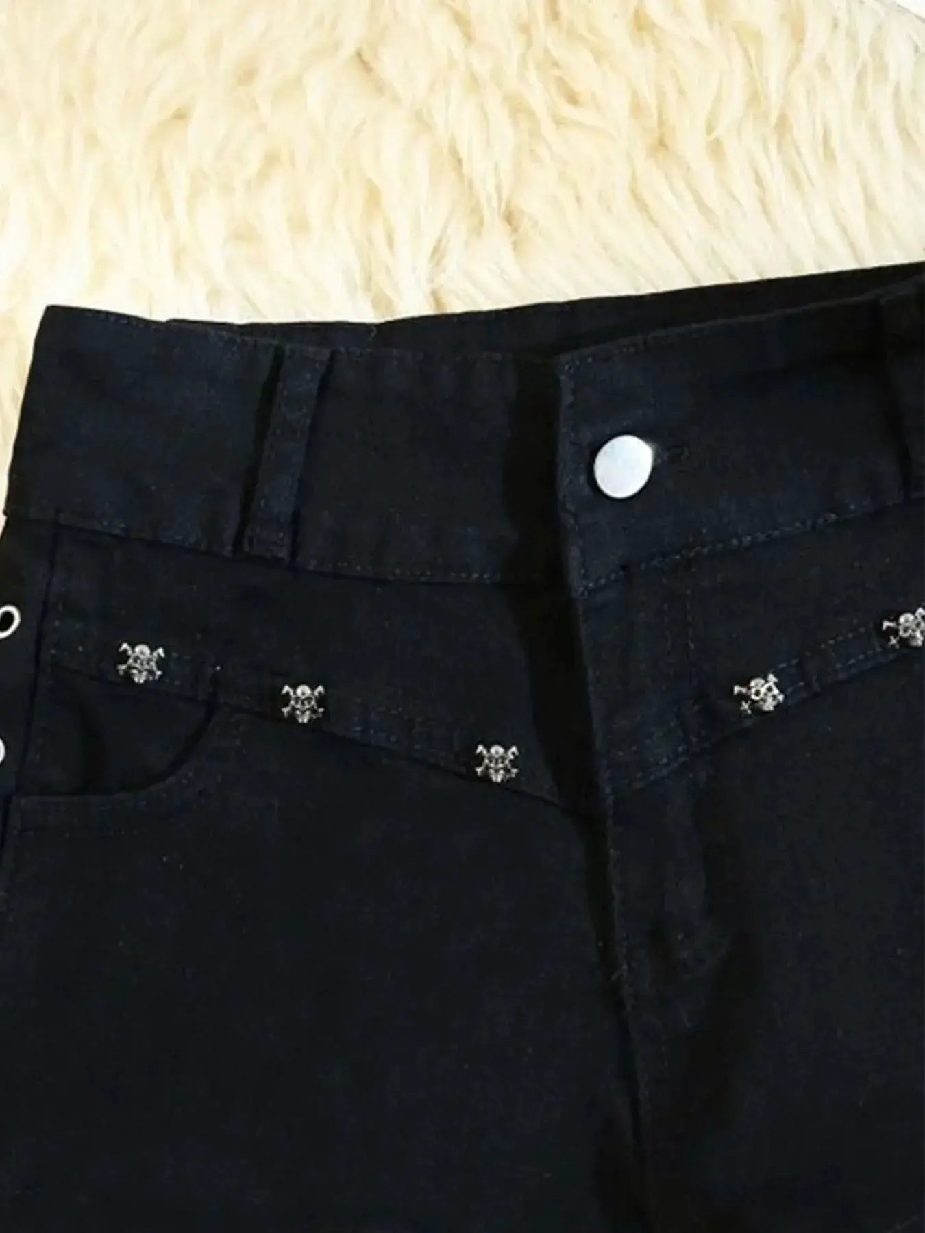 Women's black denim shorts with small silver studs on back pockets, by Simples Market