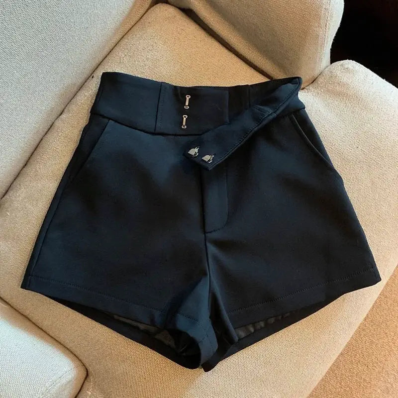 Women's black high-waisted shorts with belt detail and A-line silhouette