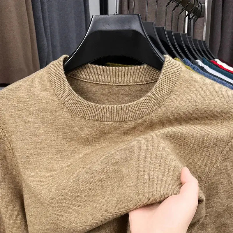 Men's beige round-neck knitted sweater on hanger; long sleeves, casual versatile top