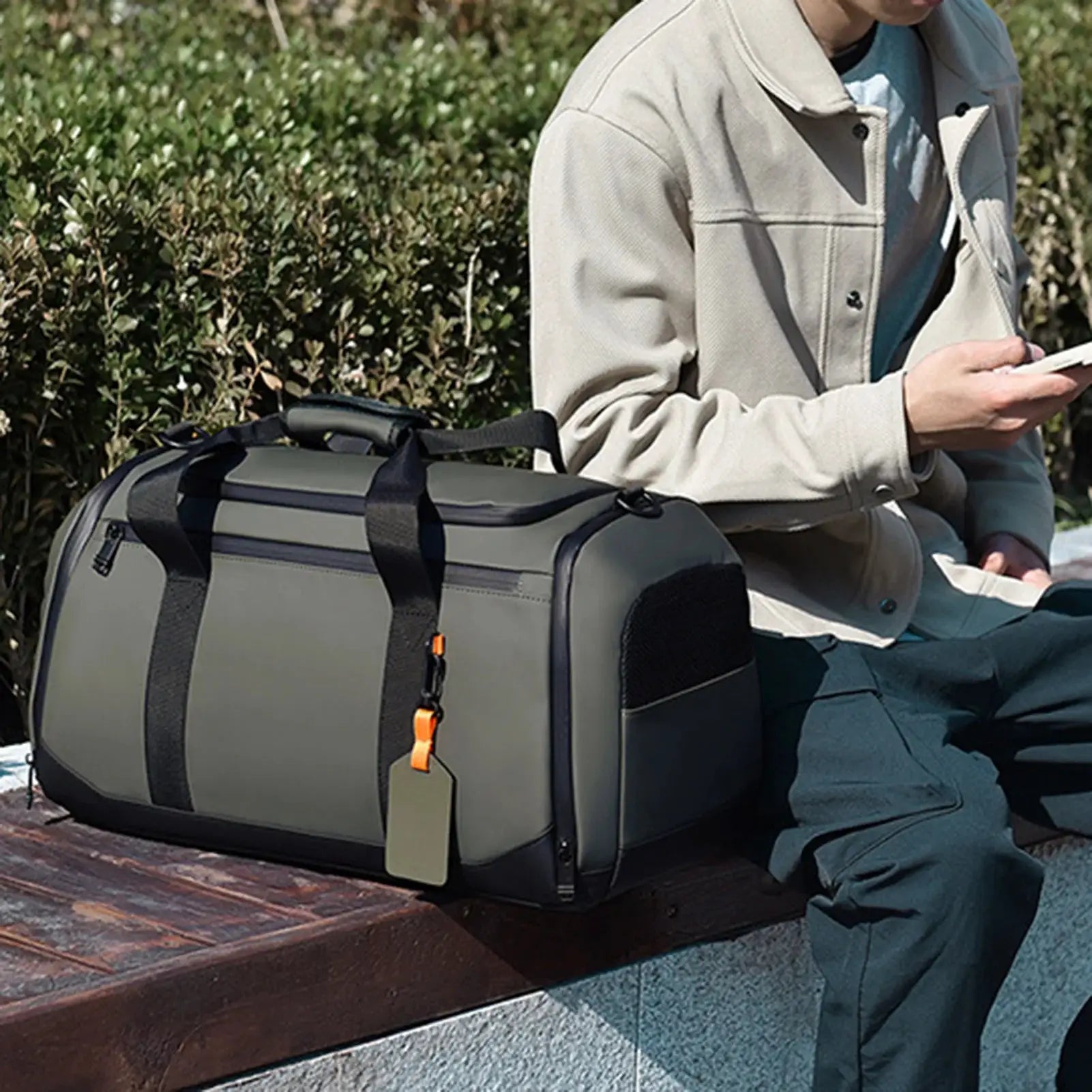 Large capacity travel tote bag, gray with black trim and orange zipper pulls, unisex gym organizer.
