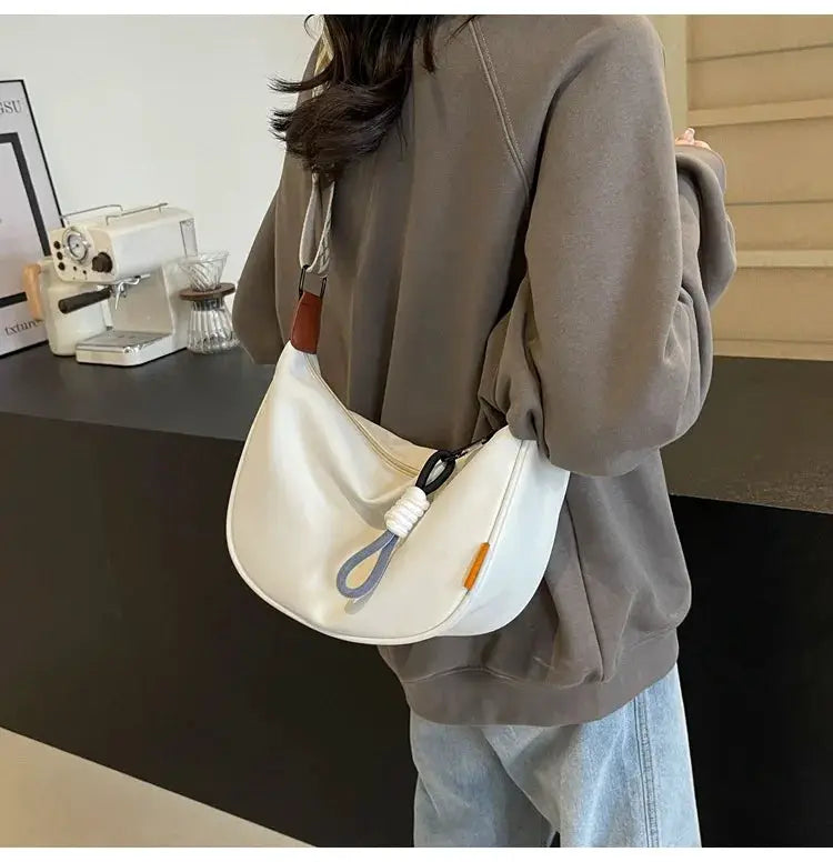 Crossbody dumpling bag white with wide strap, casual commuter style