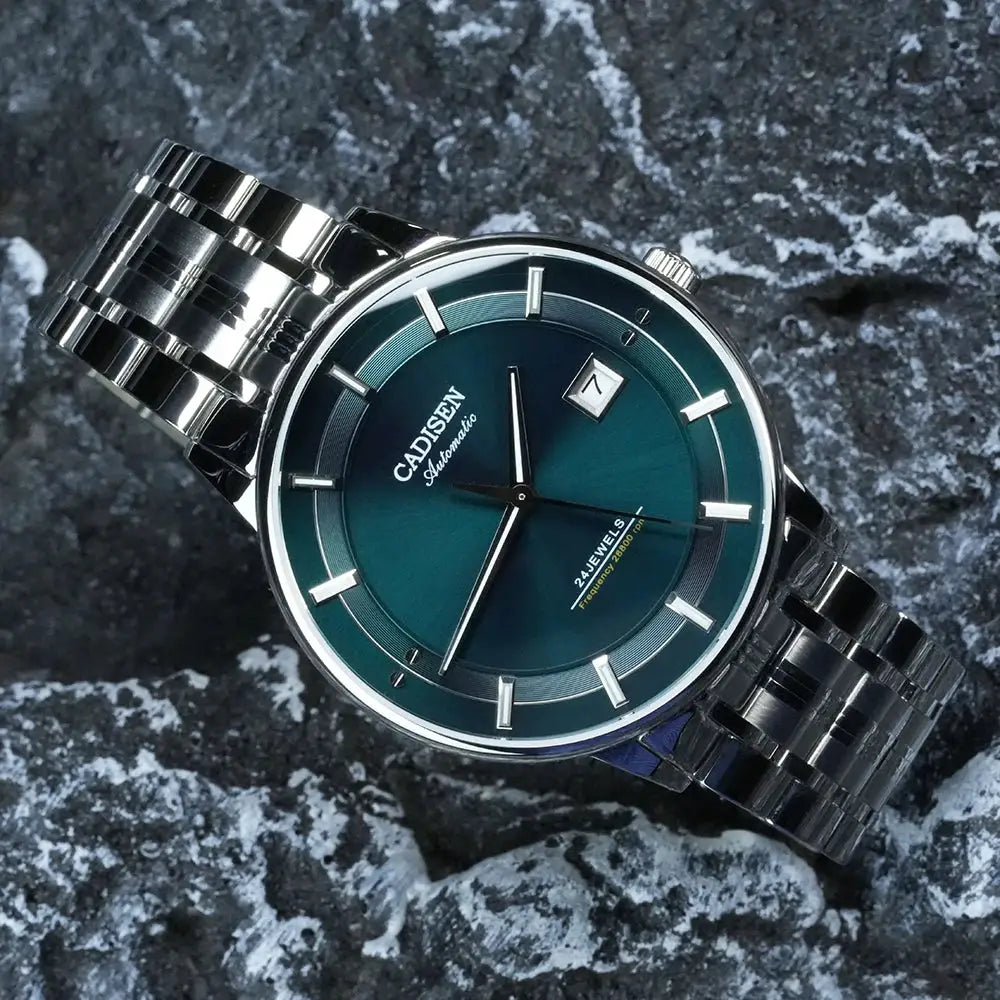 CADISEN automatic wristwatch with teal dial, stainless steel bracelet and date window.