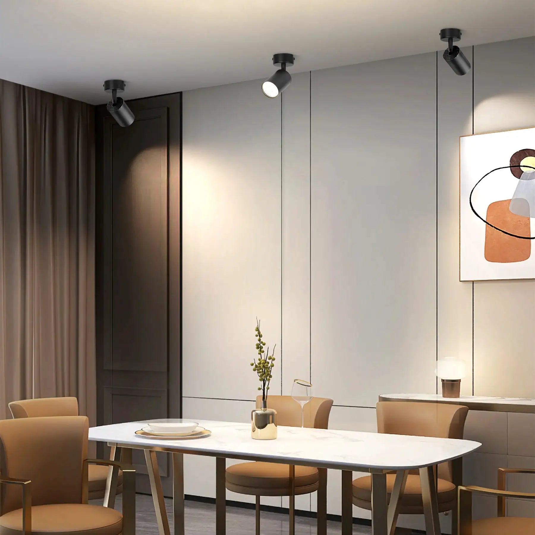 LED shop ceiling spot lamp chandelier, three black cylindrical GU10 fixtures in a modern dining room.
