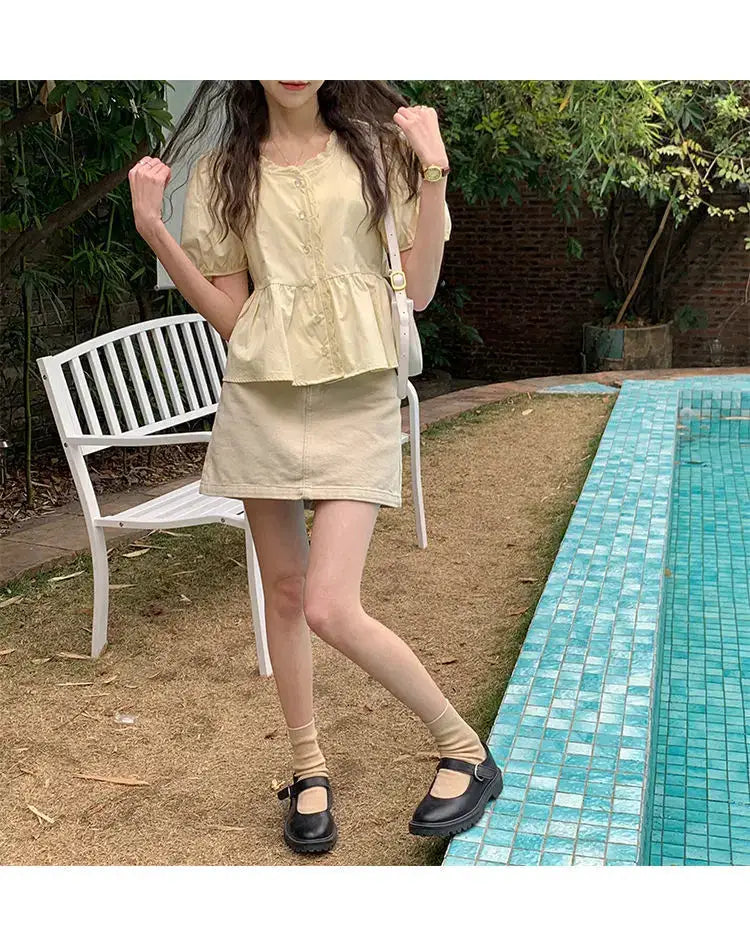 Women's two-piece beige outfit with puff-sleeve top and matching mini skirt by Simples Market