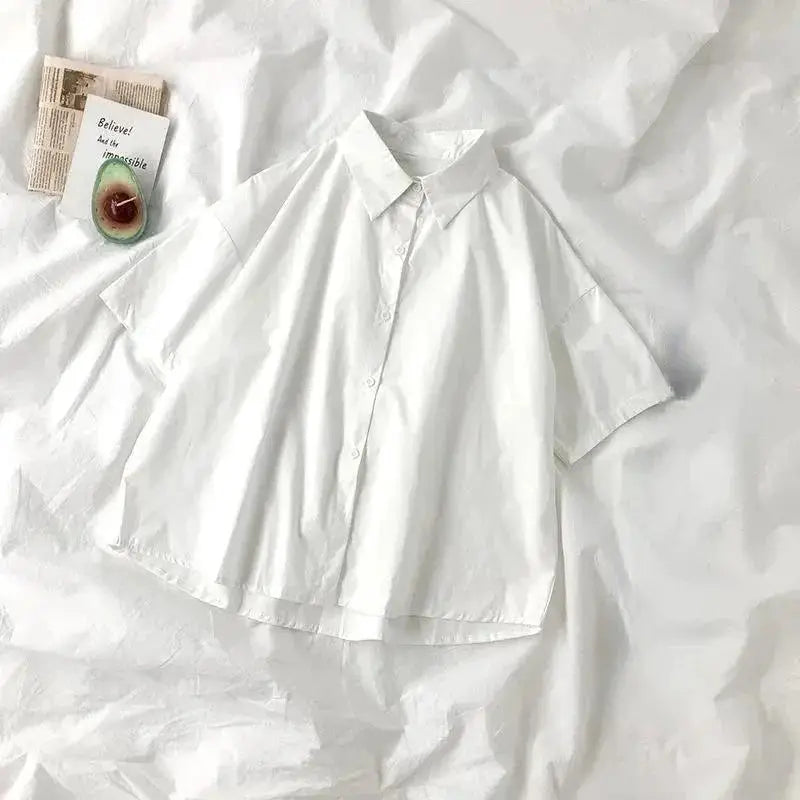 White women's short-sleeve blouse with collar and button front, casual summer style.