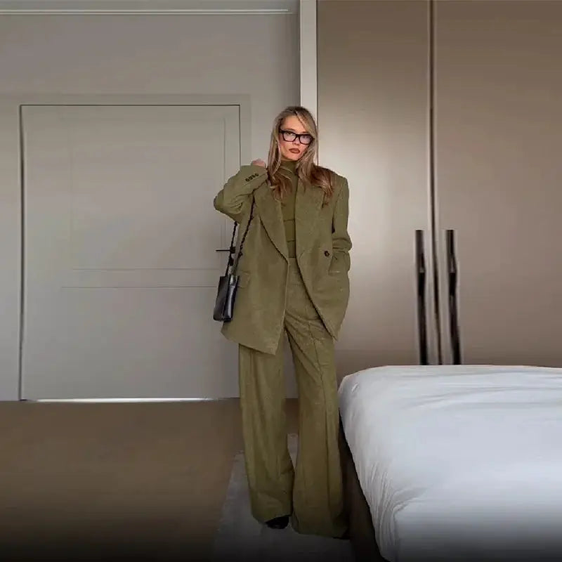 Women's olive-green blazer and matching straight-leg pants set with soft shoulder pads