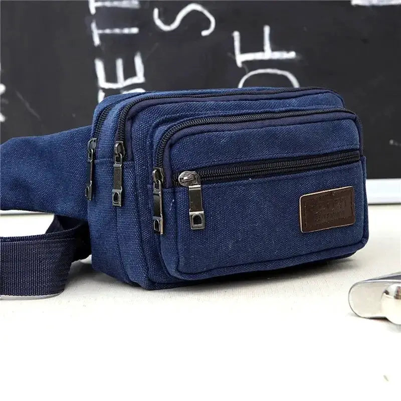 Canvas waist bag by Simples Market, blue with multiple zip pockets and adjustable strap.