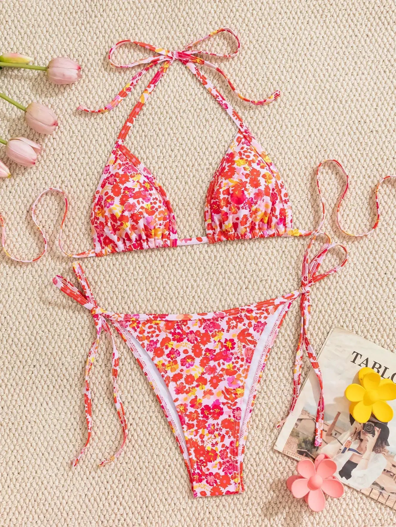 Women's pink floral bikini set with adjustable tie-side top and bottom