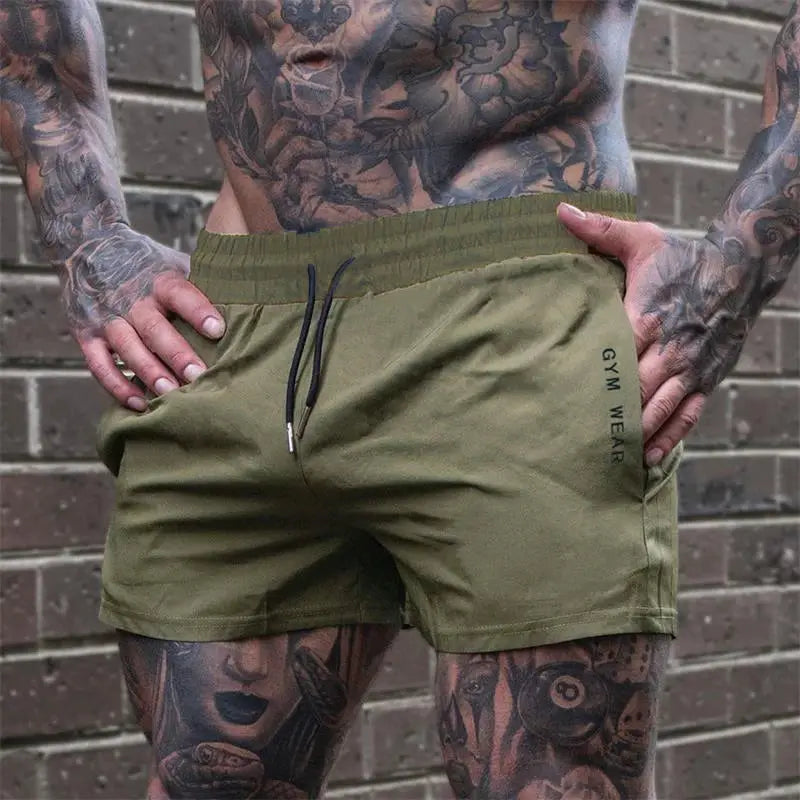 Men's olive green lightweight gym shorts with drawstring, quick-drying fabric, GYM WEAR logo.