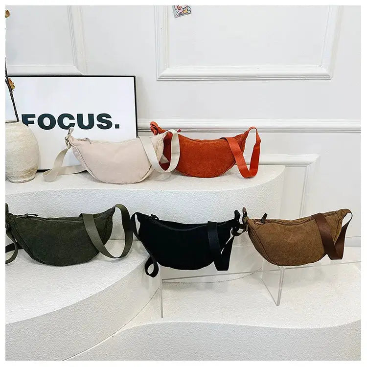 Corduroy hobo shoulder bags set of five in beige, rust, olive, black and brown with crossbody straps.