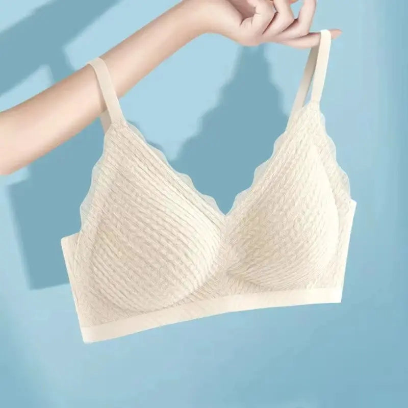Beige lace seamless bra with scalloped cups and non-slip straps.