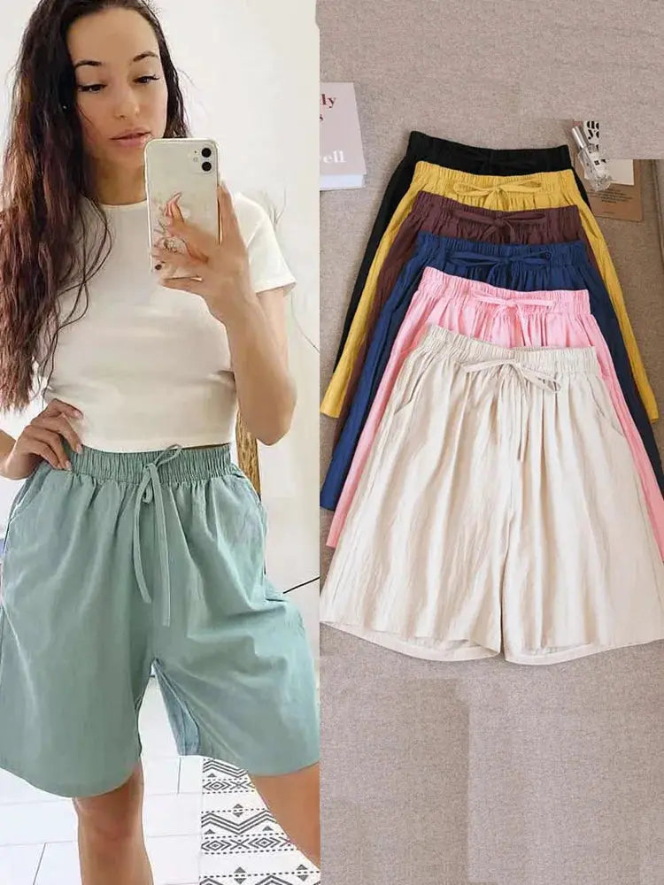 Simples Market women's cotton shorts, high-waist loose fit with two pockets; teal worn by model, other colors shown.