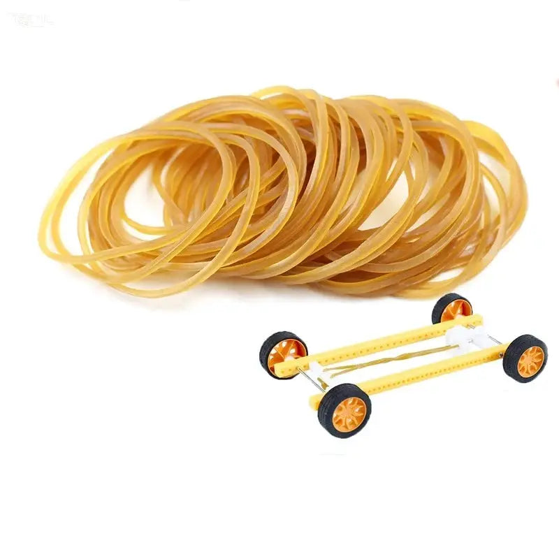 Yellow rubber band set with a small toy cart chassis