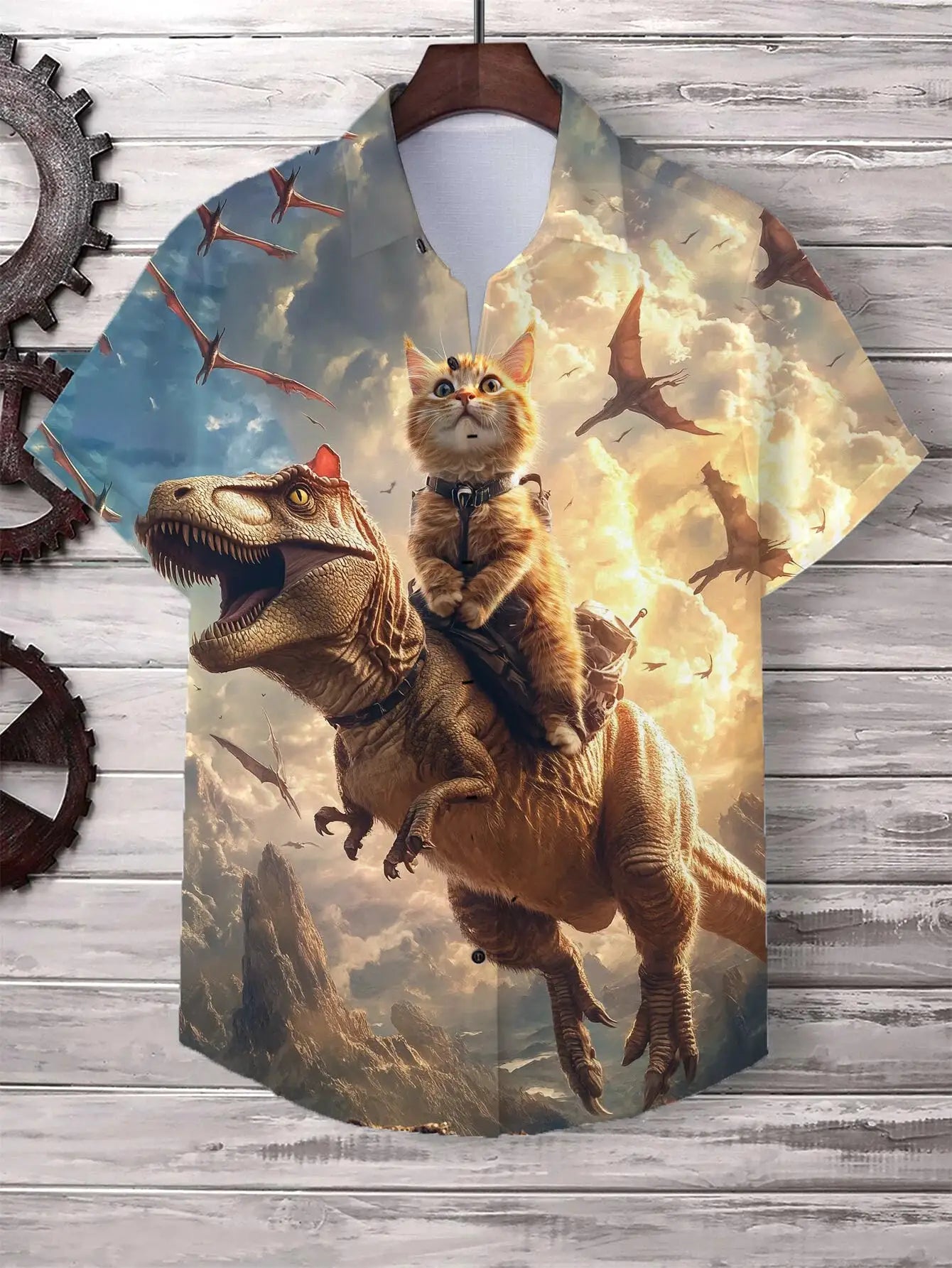 Men's cat graphic Hawaiian shirt with a cat riding a dinosaur amid flying pterosaurs against a cloudy sky