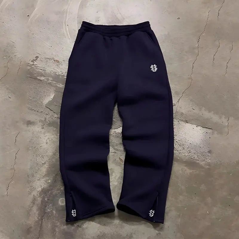 Autumn drawstring zipper sweatpants in navy with Simples Market logo on thigh and cuffs