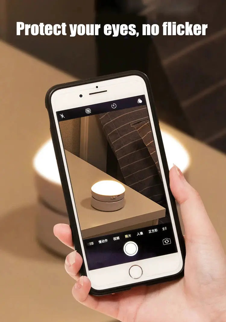 Round USB motion-sensor night light with energy-saving LED, white/gray finish for bedroom or hallway.