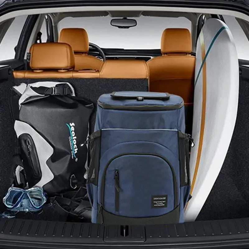 Soft insulated cooler backpack 30L by Simples Market in blue, in car trunk with surfboard
