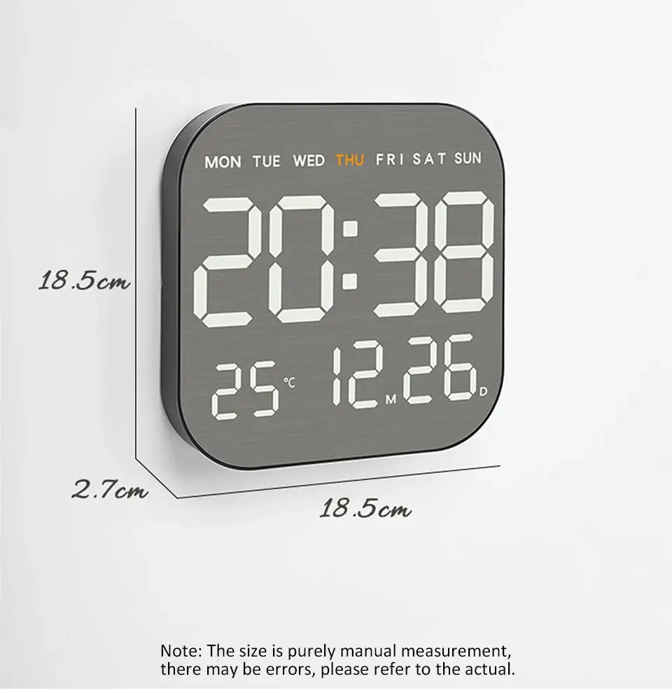 Mirror brushed-finish wall clock with large digital display showing time, day, temperature, and date (18.5 cm square).