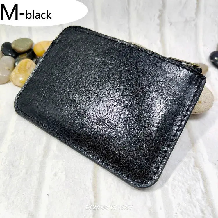 Black leather mini zipper waist bag; compact belt pack for cards, IDs, passport, and phone with zip pocket