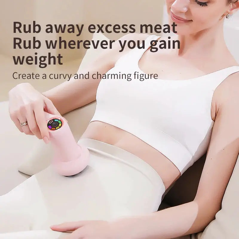 Cordless pink body massager used on abdomen for cellulite
