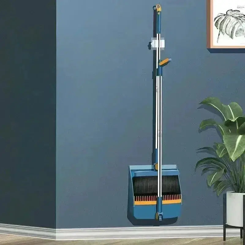Blue broom and dustpan set with wall-mounted holder and extendable handle