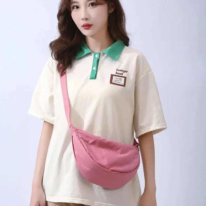 Pink nylon padded crossbody bag with adjustable strap