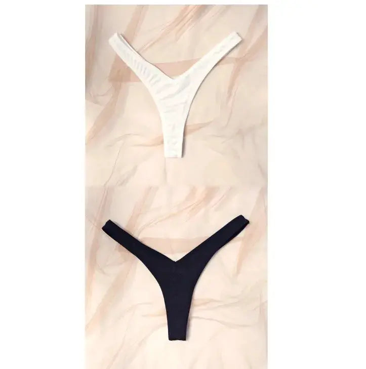 Two thongs: white and black low-rise hip-lifting briefs by Simples Market