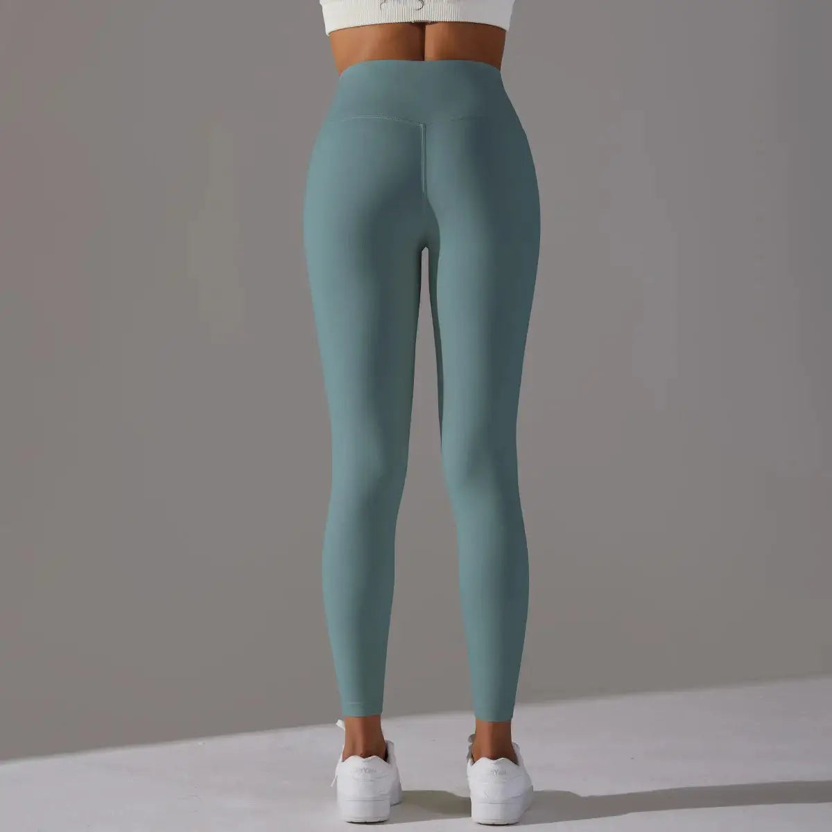 High Waist Naked Feeling Leggings for women in teal by Simples Market, ideal for fitness, yoga and running.