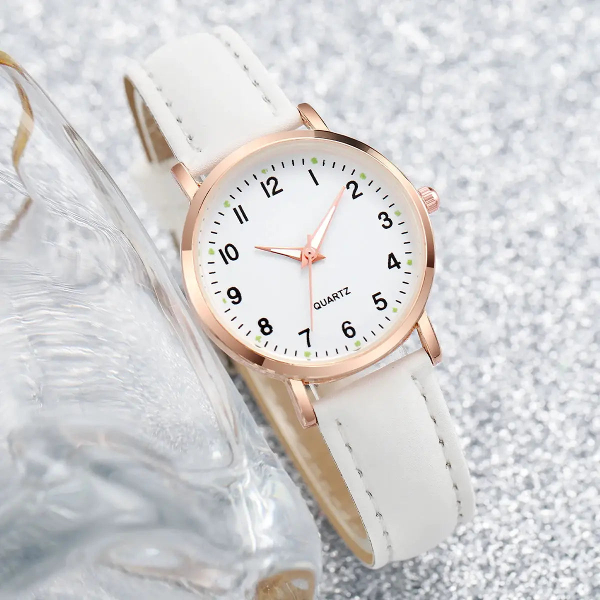 Women wristwatch with white leather strap, rose-gold case, white dial and black Arabic numerals