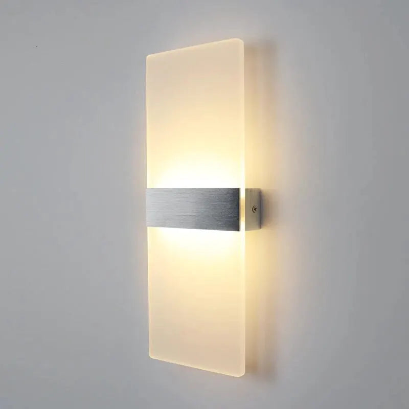 LED acrylic wall light by Simples Market, long wall sconce with brushed metal band and warm ambient glow.