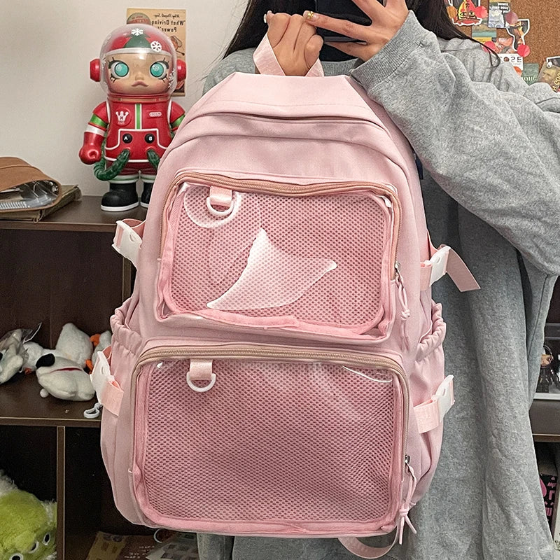 Pink ita bag backpack by Simples Market with transparent front mesh pockets and large-capacity school bag