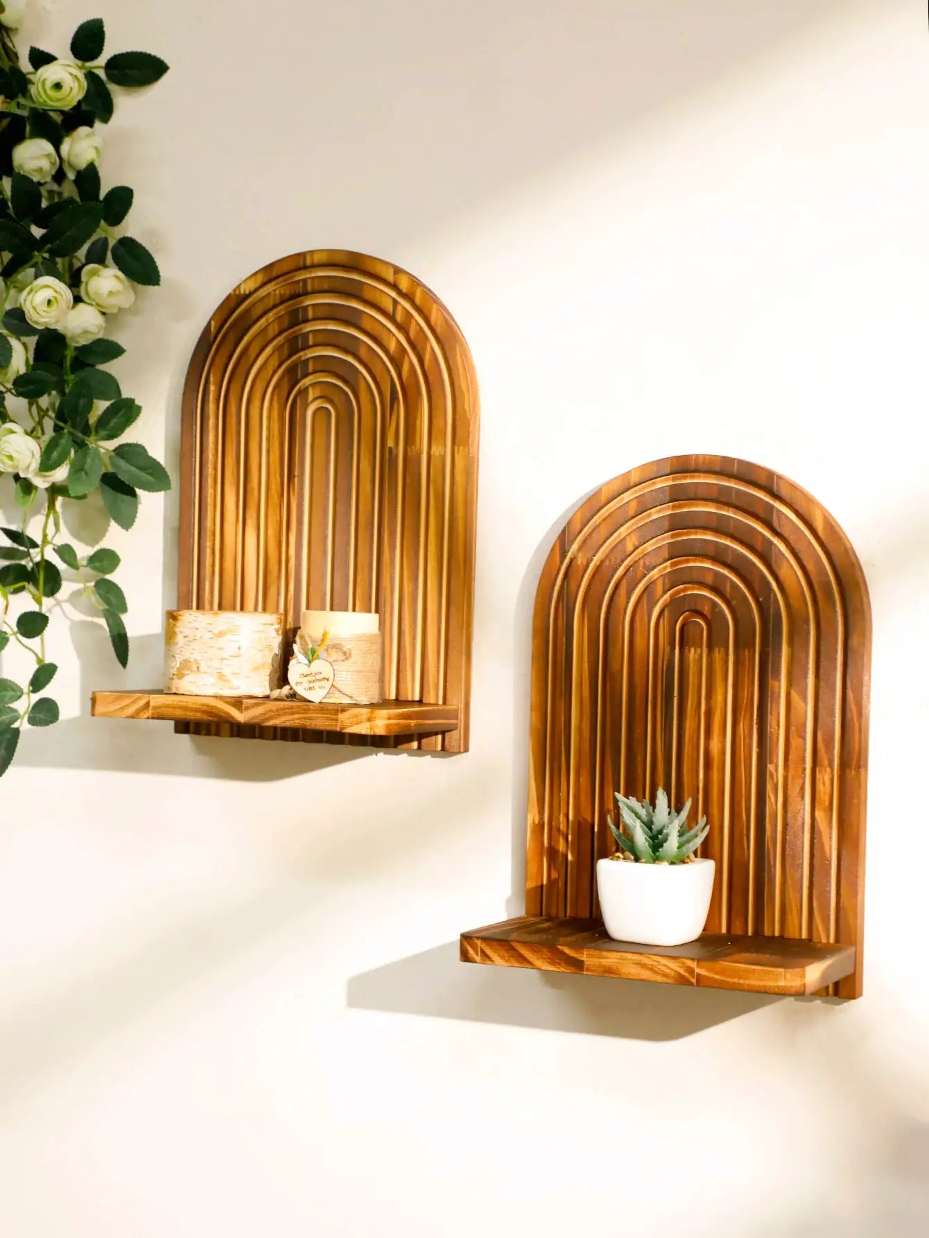 Two arched boho wooden wall shelves with natural finish for plant display by Simples Market