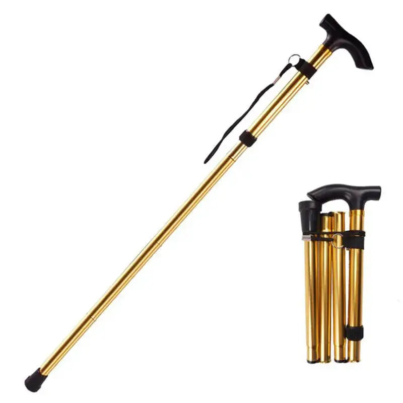 Telescopic trekking pole by Simples Market; gold aluminum alloy walking stick with black handle and wrist strap.