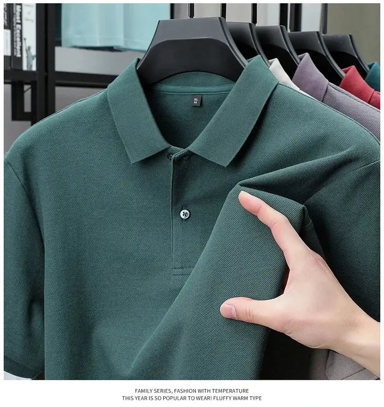 Men's 100% cotton polo shirt in green with polo collar and button placket; displayed with other color options.