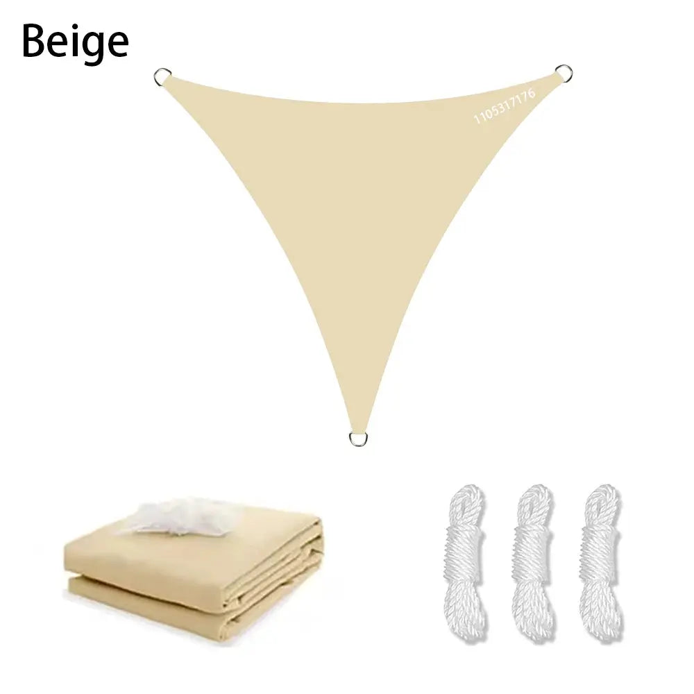 Beige triangle sun shade sail for outdoors with corner rings, folded sail, and 3 ropes