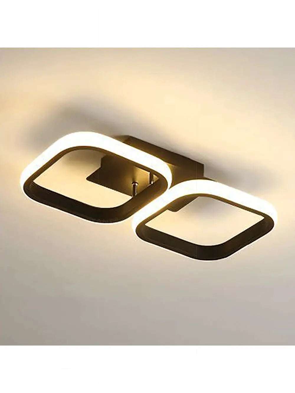 LED ceiling light by Simples Market; modern double interlocking square ring luminaire with black frame and warm white LED