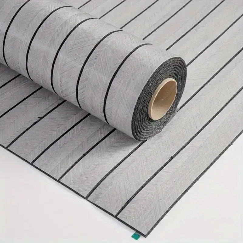 Self-adhesive wallpaper roll with gray wood-grain texture and black plank lines for DIY walls or ceilings
