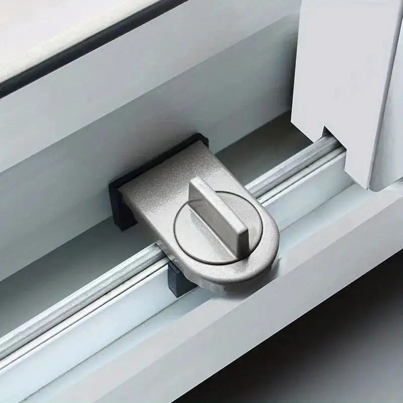 Simples Market sliding sash stopper lock in silver mounted on a window track