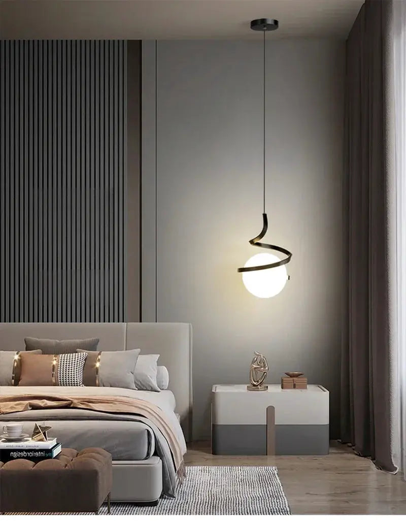 Nordic LED pendant light by Simples Market; black spiral frame around white globe in a modern bedroom.