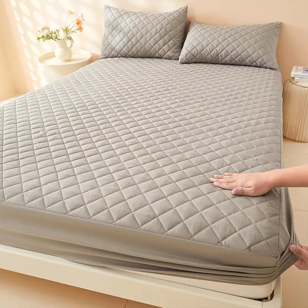 Quilted waterproof fitted sheet in gray for mattress; machine washable mattress protector