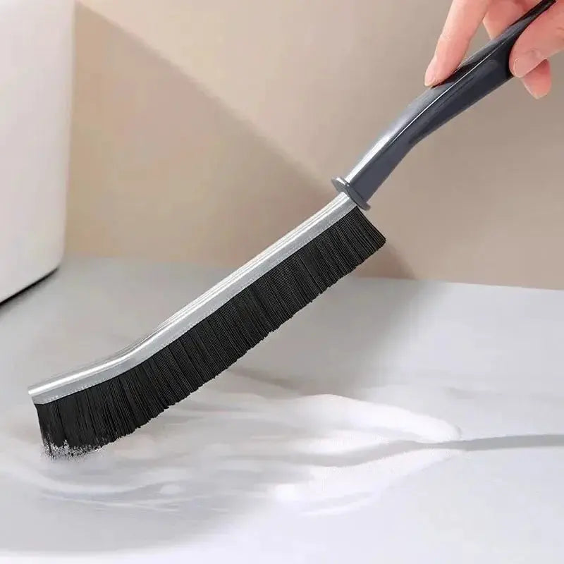Grout gap cleaning brush with curved gray handle and stiff black bristles (1 piece)