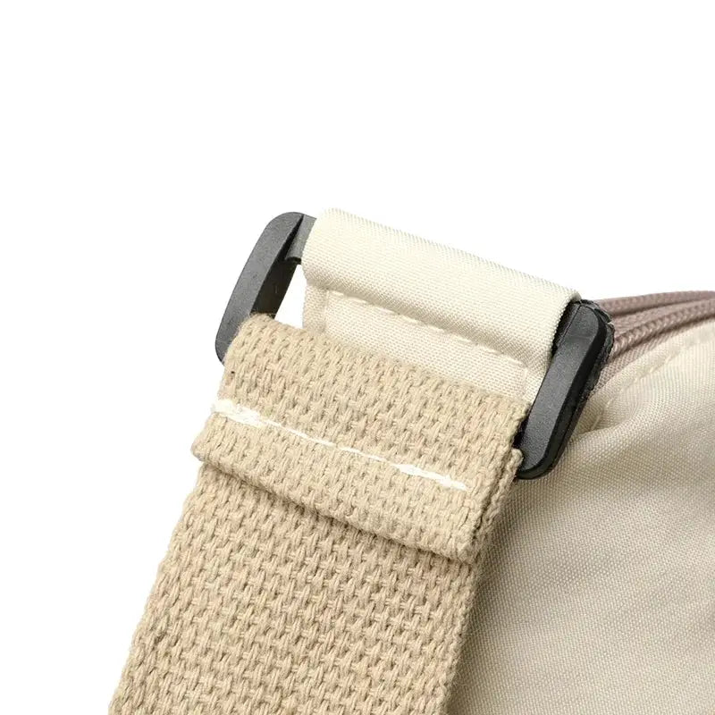 Canvas crossbody bag with beige strap, adjustable buckle, high-capacity multi-pocket purse