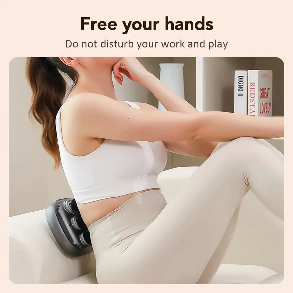 Electric fascia gun with 6 heads; gray massage device used on lower back by a woman in beige leggings