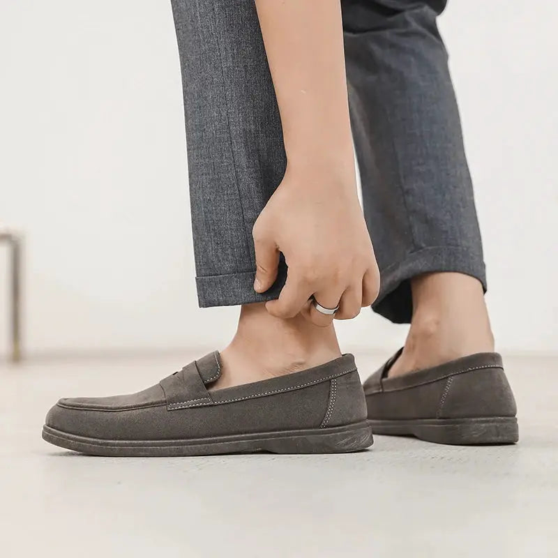 Pair of gray men's slip-on loafers, lightweight casual walking shoes